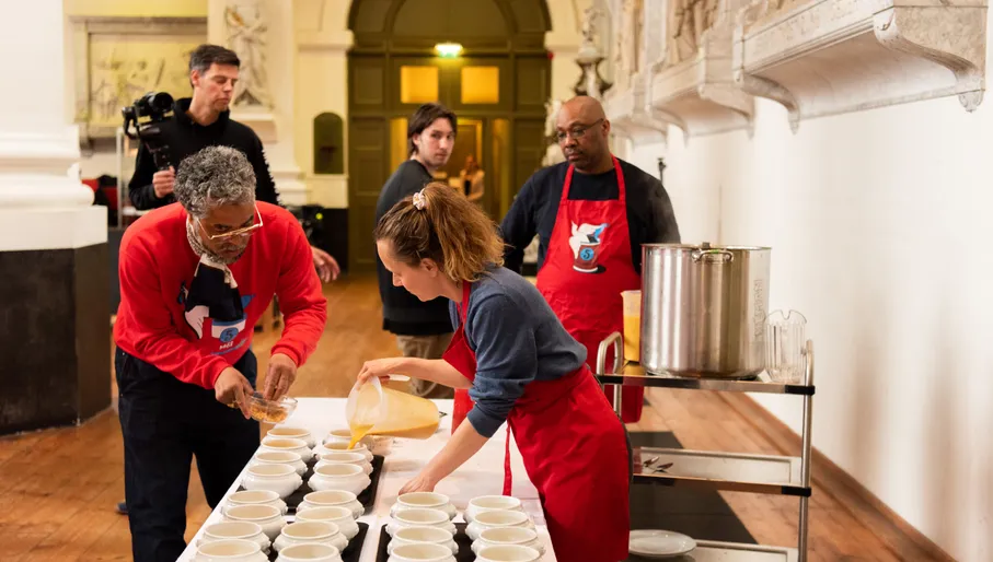 People pouring Vrijheidssoep during the Vrijheidsmaaltijden on 5 mei, may 5th, liberation day meals, bevrijdingsdag.