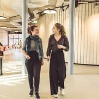 Two students walking and talking