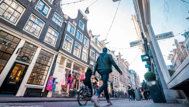 Shoppers at the Negen Straatjes shopping area.