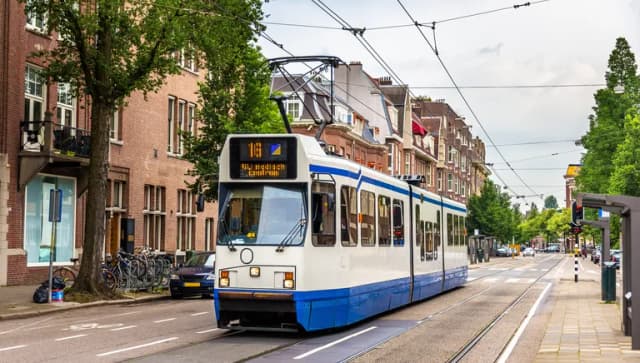 A tram driving in Amsterdam - the Netherlands