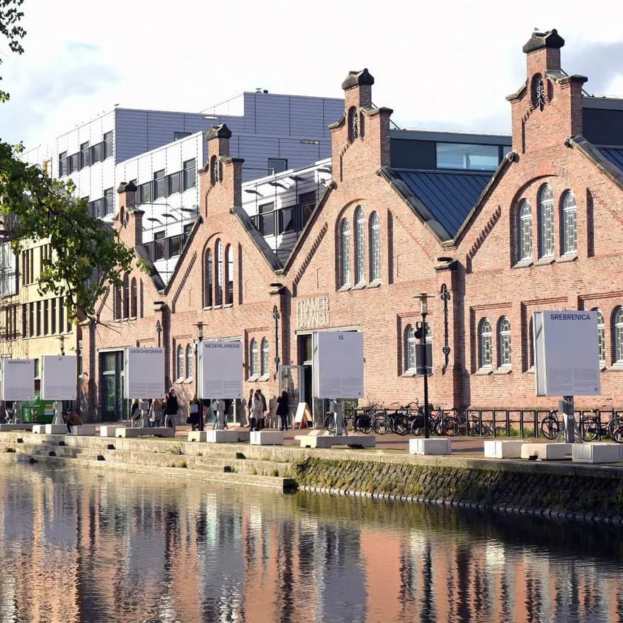 Framer Framed gallery front view with outdoor exhibition along the canal