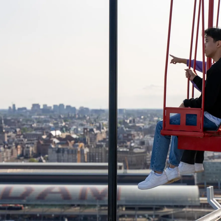 People on the / ADAM Lookout / swings