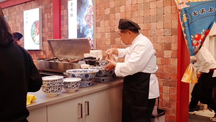 Chef preparing noodles at Jinweide Beef Noodles Chinese restaurant