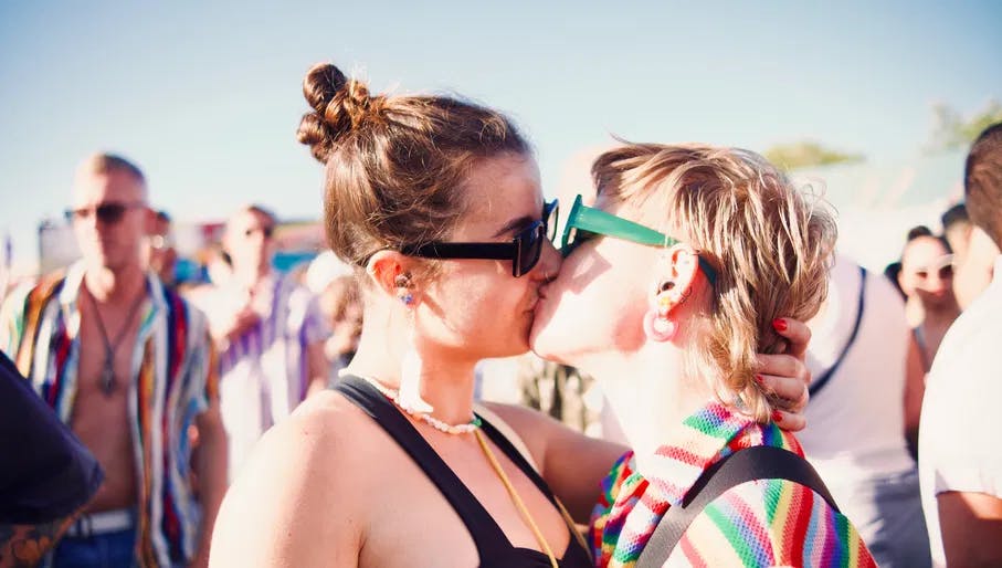 A couple kissing at Tropikali Festival 2024.