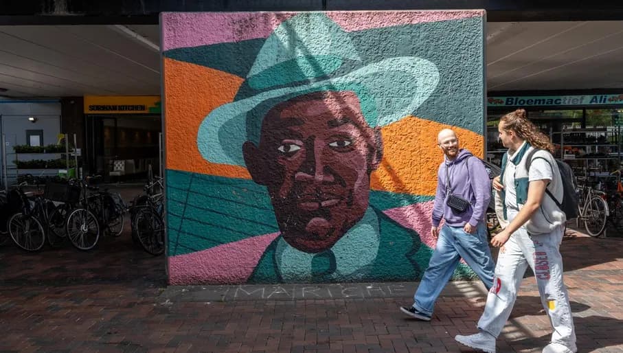 A couple enjoy a walk through Amsterdamse Poort shopping district.