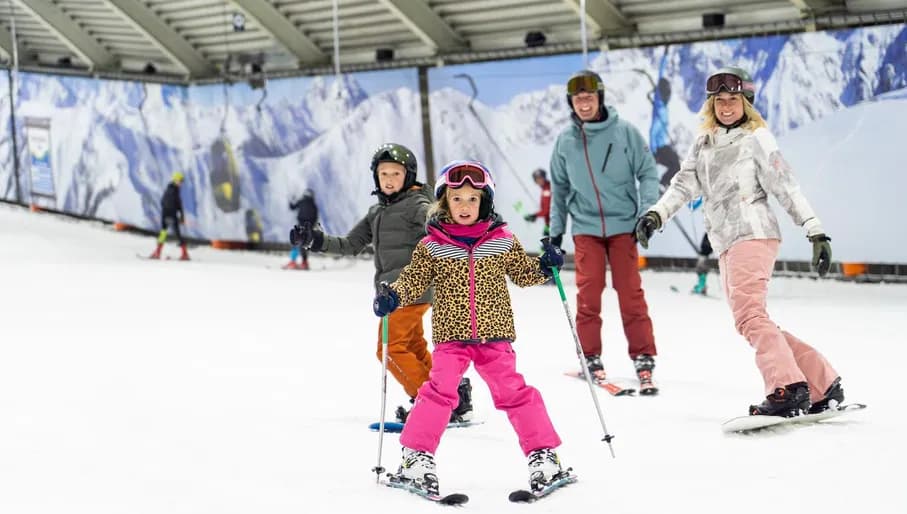 Snow World family skiing together