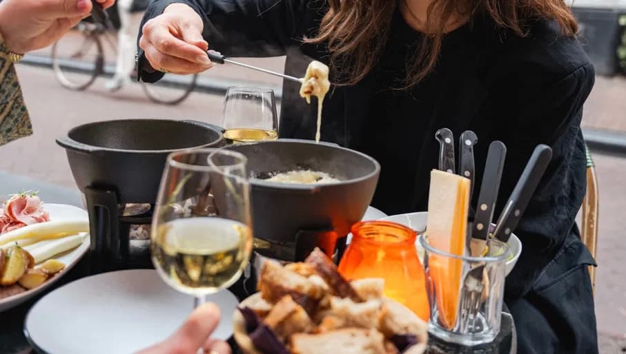 Smelt people enjoying cheese fondue