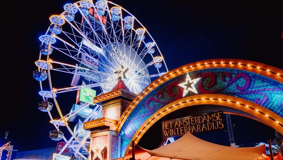 Ferris wheel and attractions at Het Amsterdamse Winter Paradijs