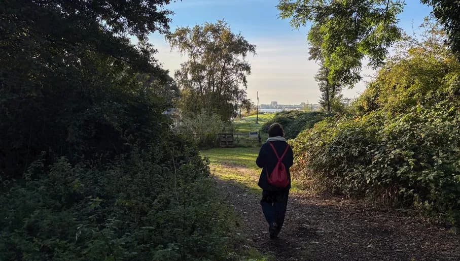 Woman walking at Schellingwouderpark. Content Creation Day Amsterdam Noord - North