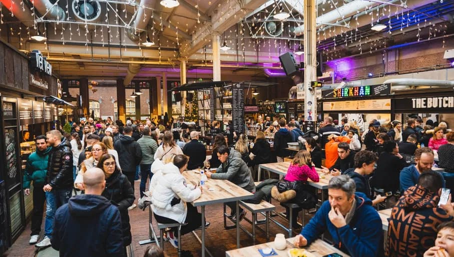 Foodhallen people sitting inside to eat