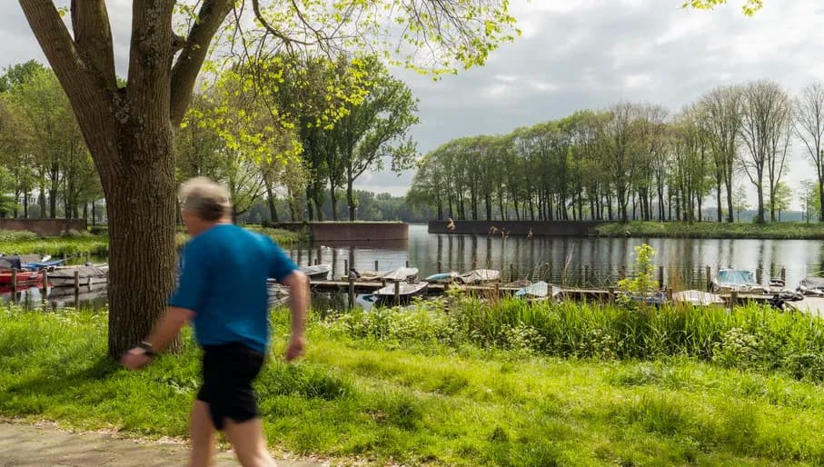 A person jogs alongside Sloterplas.