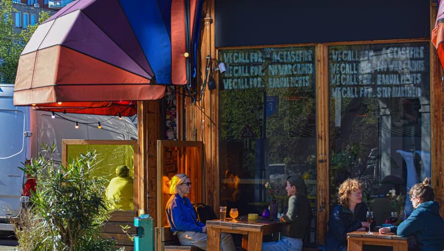 People drinking outside at LGBTQ+ bar Pamela.