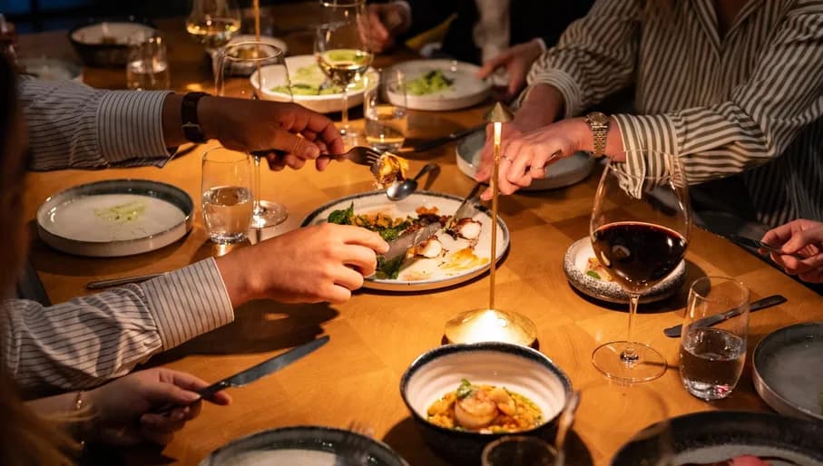 Diners tucking into dishes at ARCA Portugese restaurant at the art'otel