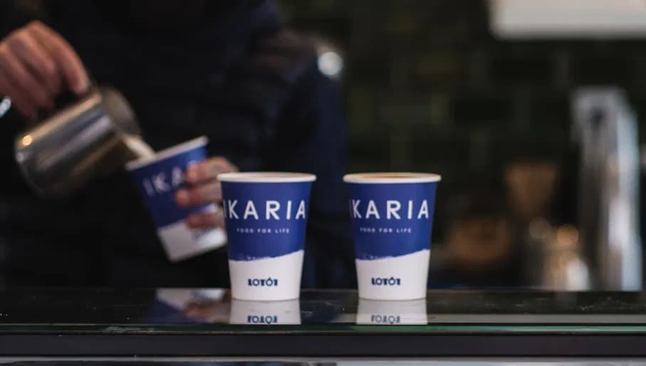 Ikaria coffee kiosk barista preparing coffee to go's