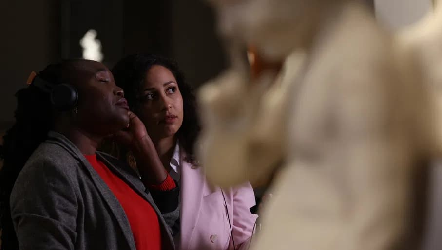 Woman listening to a tour for people who are deaf in Rijksmuseum