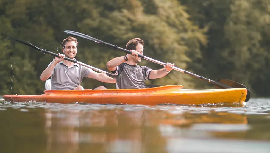 Two men paddling with a kayak from the canoe rental in the Amsterdamse Bos