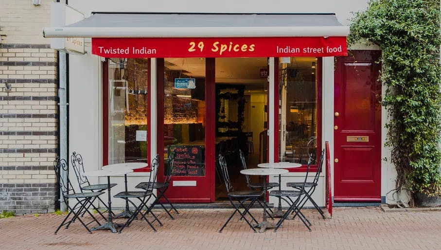 Exterior and terrace of 29 Spices Indian streetfood restaurant in the Jordaan.