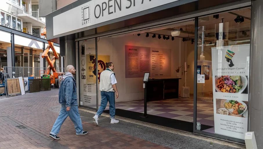 A couple enters OSCAM - Open Space Contemporary Art Museum.