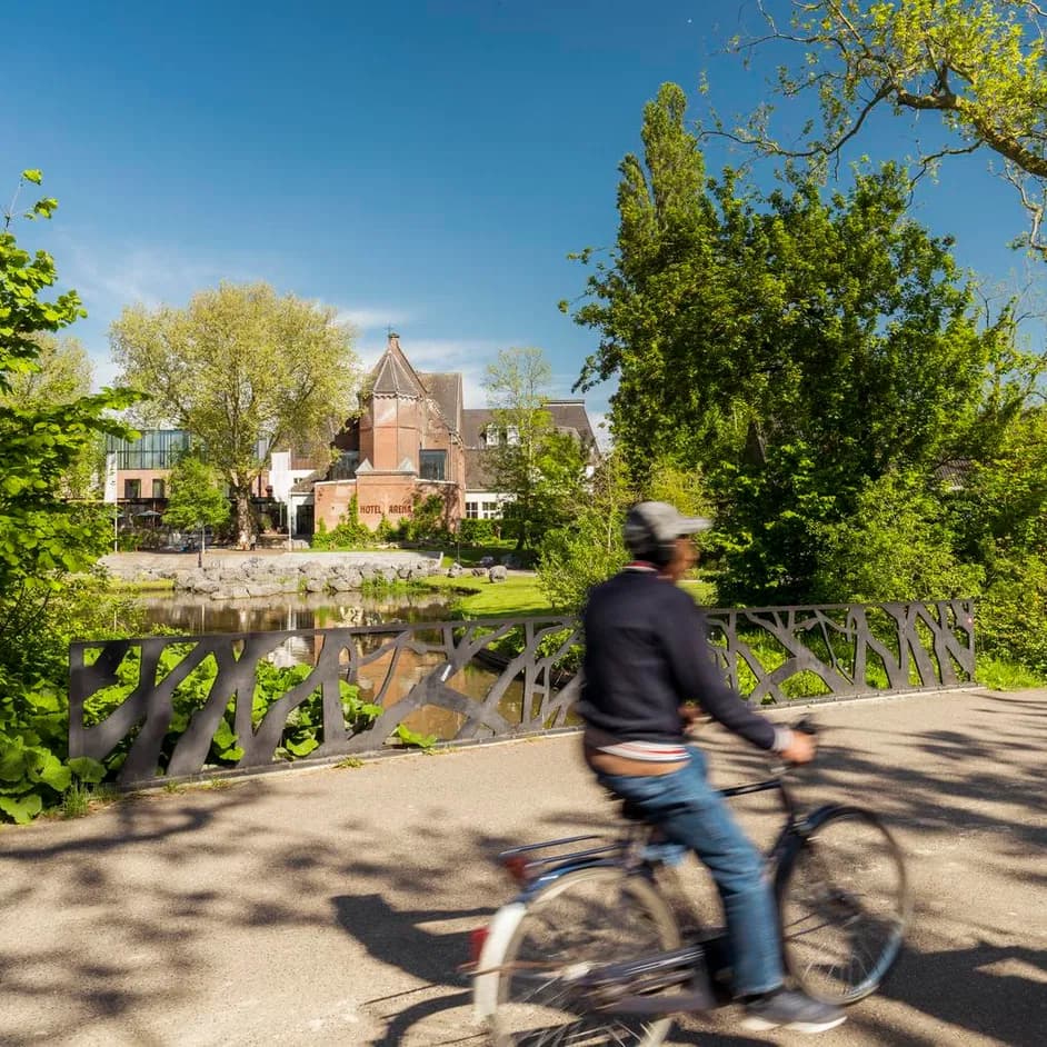 A person cycles through Oosterpark.