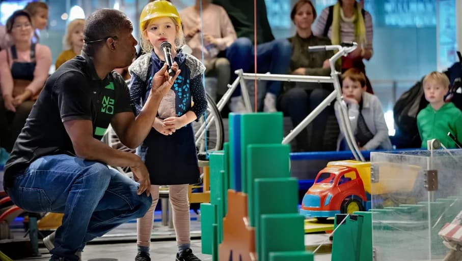 Children taking part in chain reaction experiement at NEMO Science Museum