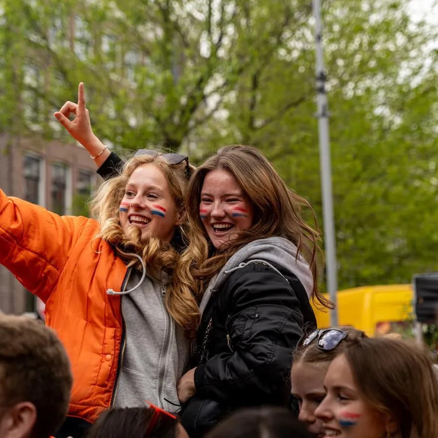 Two girls at Elandsgracht celebrating King's Day 2024.