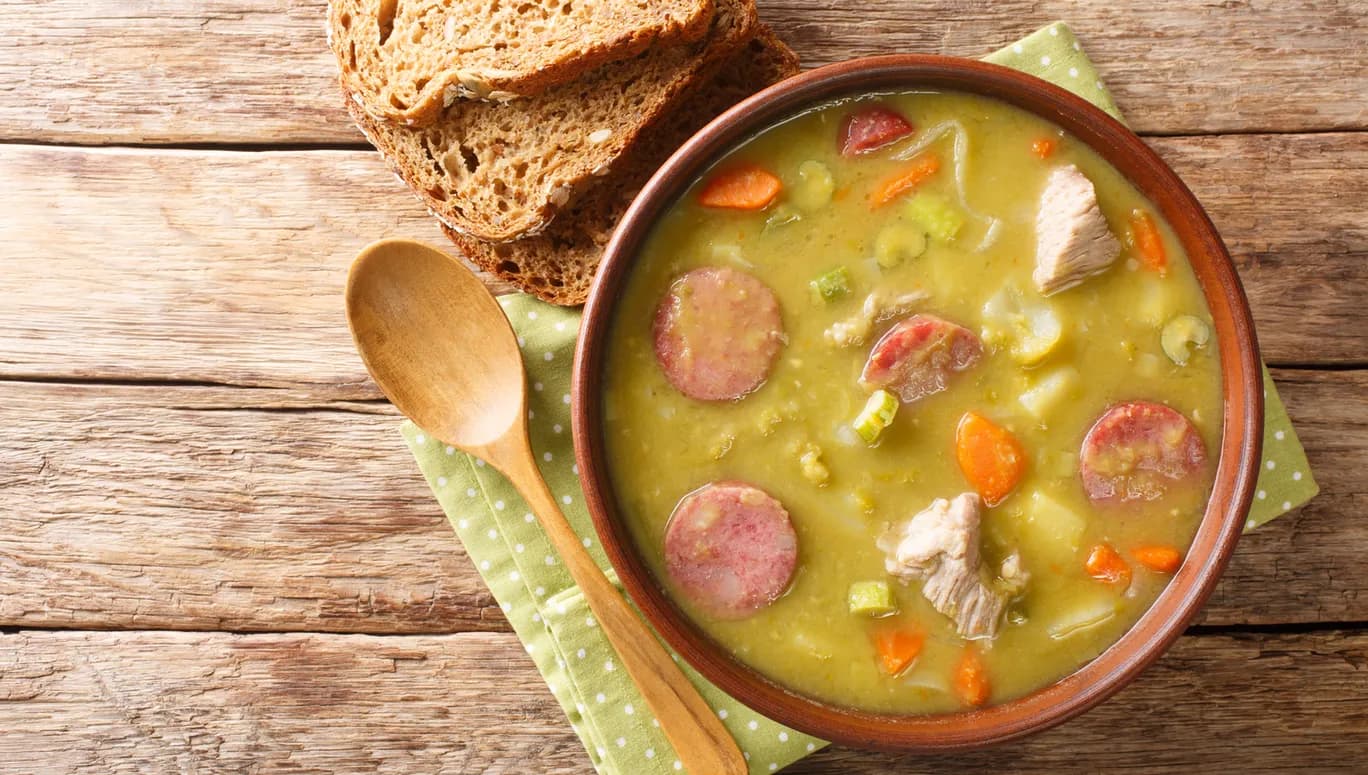 Classic Dutch pea soup erwtensoep, snert closeup in the plate on the table. horizontal top view from above
1873721881
Typically Dutch foods