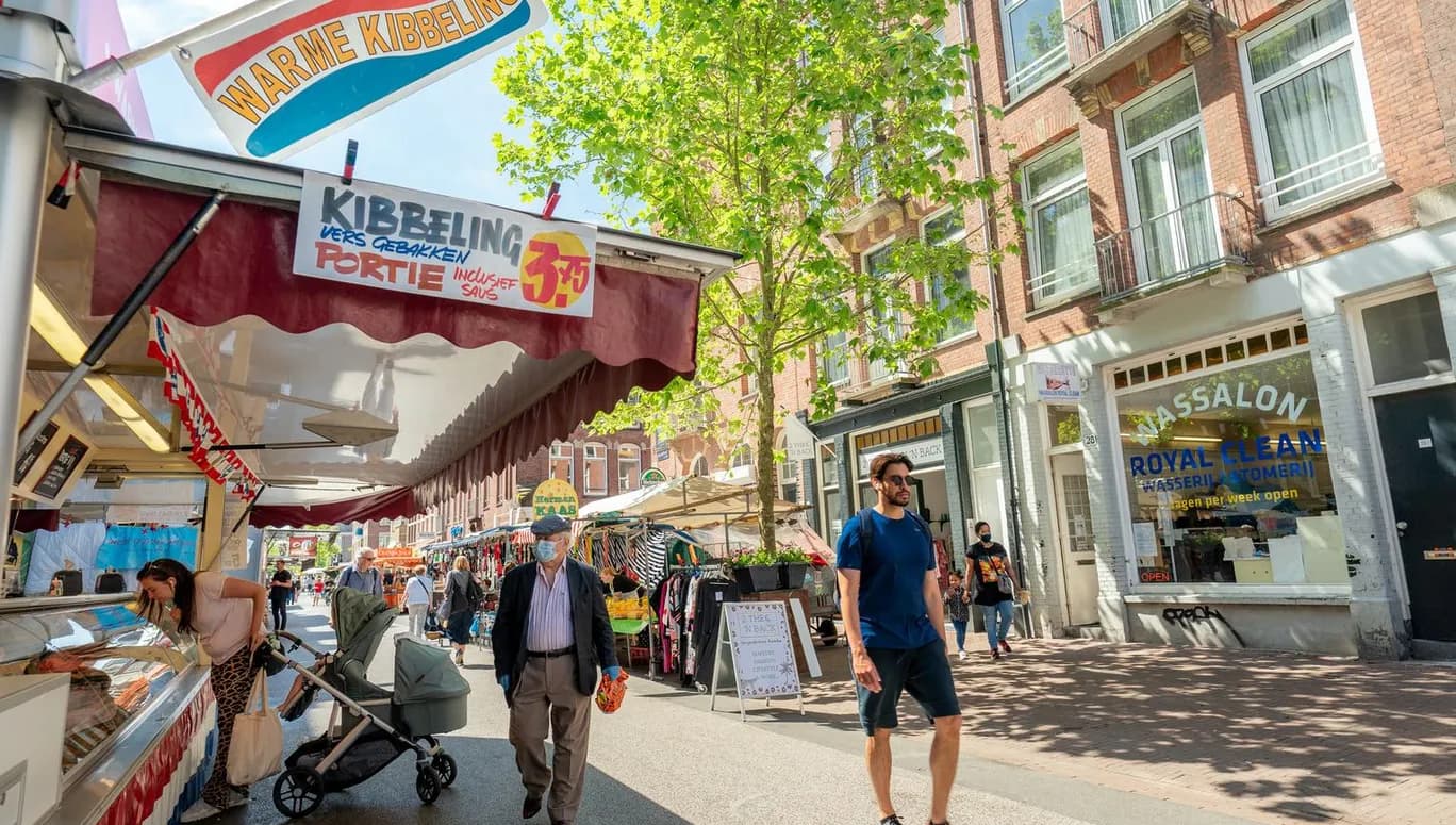People shopping at the Ten Katemarkt market