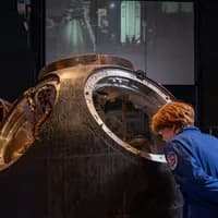 boy looking at astronaut exposition