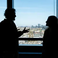 Man and woman discussing business.