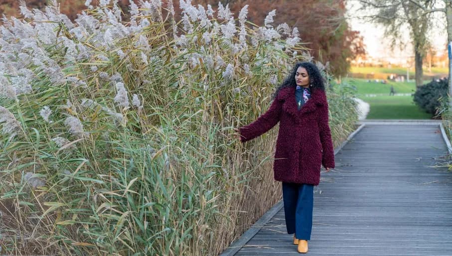 Woman walking over a bridge in Westerpark.