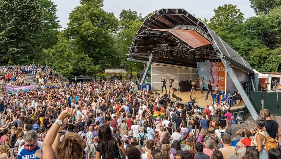 A crowd of people celebrating at the pride park festival