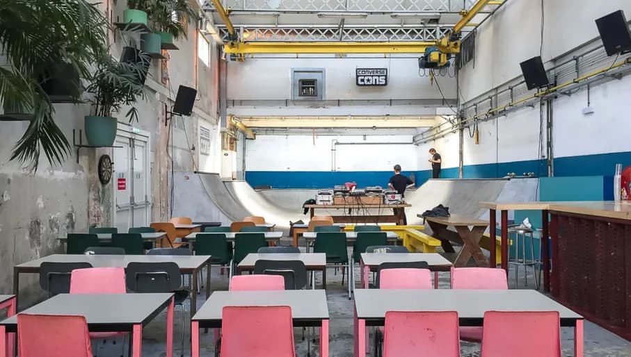 Skatecafé interior with tables and skating rink