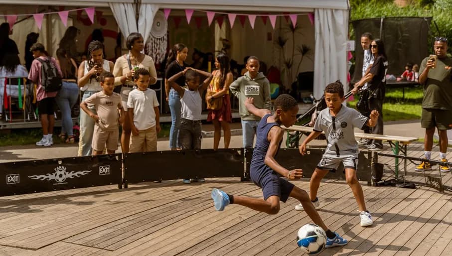 Kids playing football at Kwaku Summer Festival.