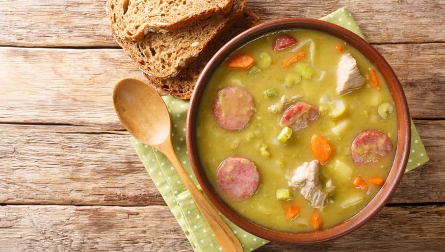 Classic Dutch pea soup erwtensoep, snert closeup in the plate on the table. horizontal top view from above
1873721881
Typically Dutch foods