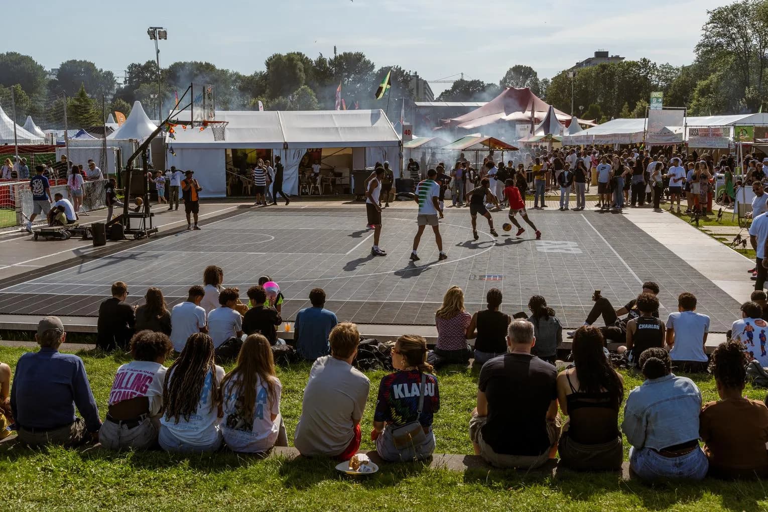 People and Kids playing football at Kwaku Summer Festival